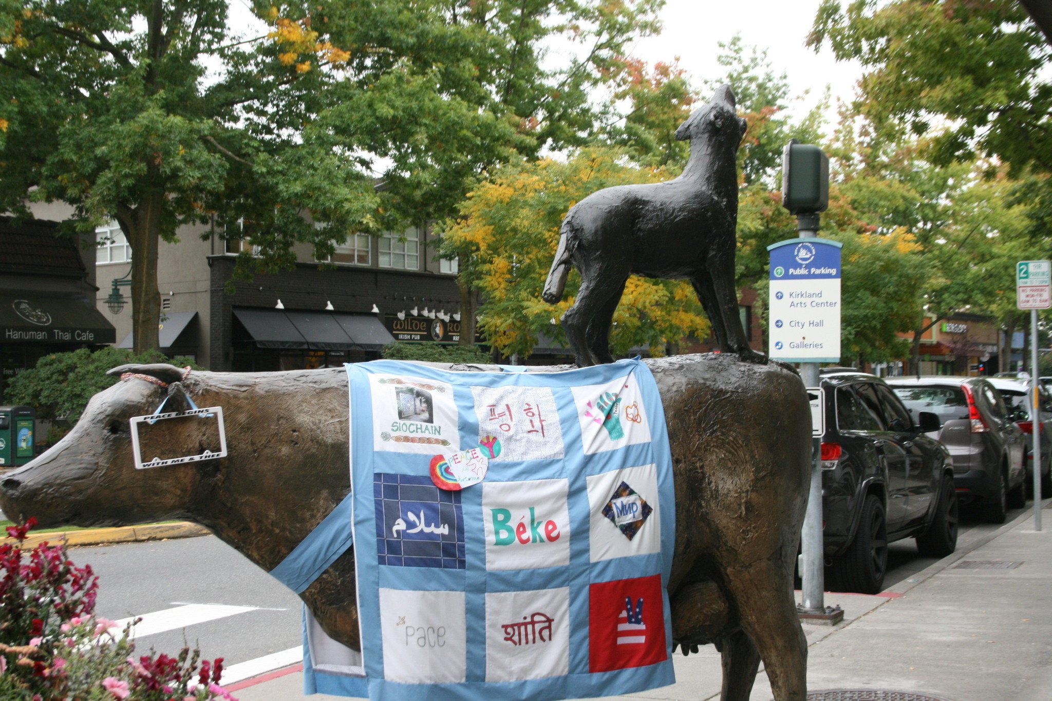 A peace quilt made by the Women of Wisdom is on display on the Cow and Coyote statue in downtown Kirkland on Sept. 16. CATHERINE KRUMMEY / Kirkland Reporter