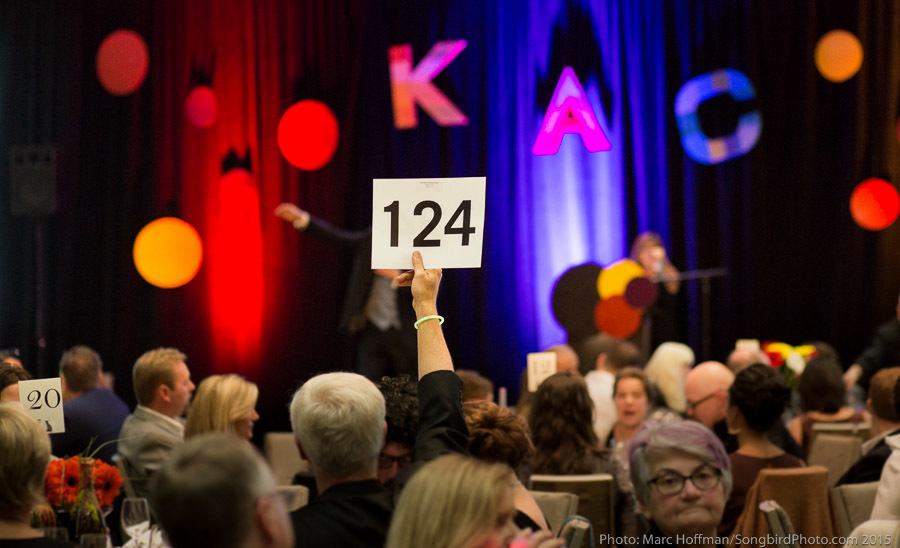 People participate in the live auction at a previous ARTbeat. Credit: Marc Hoffman / Songbird Photography