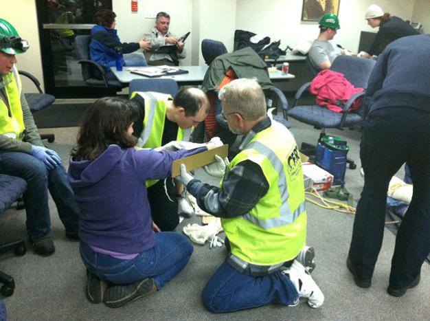 Participants in a previous Community Emergency Response Team (CERT) training program learn how to assess and take care of injuries. Registration is now open for the next program that begins on Sept. 11.