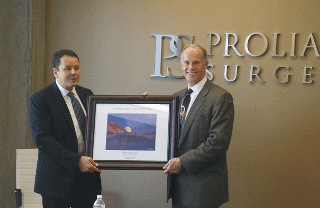 Proliance CEO David Fitzgerald (left) presents Sen. Rodney Tom with the Proliance Surgeons’ “Distinguished Leadership Award.”