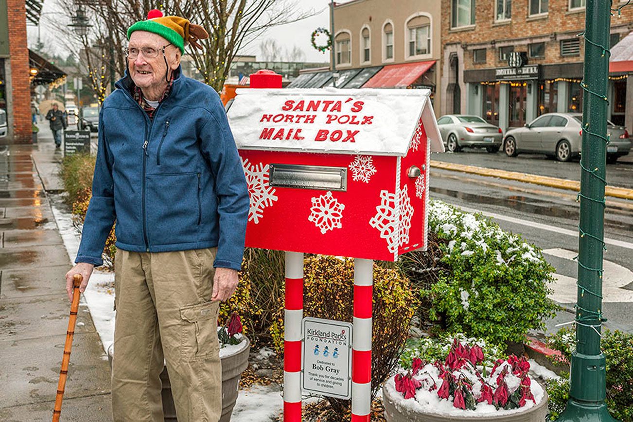 Former Kirkland resident Bob Gray stands beside the Santa mailbox dedicated to him by the Kirkland Parks Foundation. Contributed photo/Don McGehe Photography