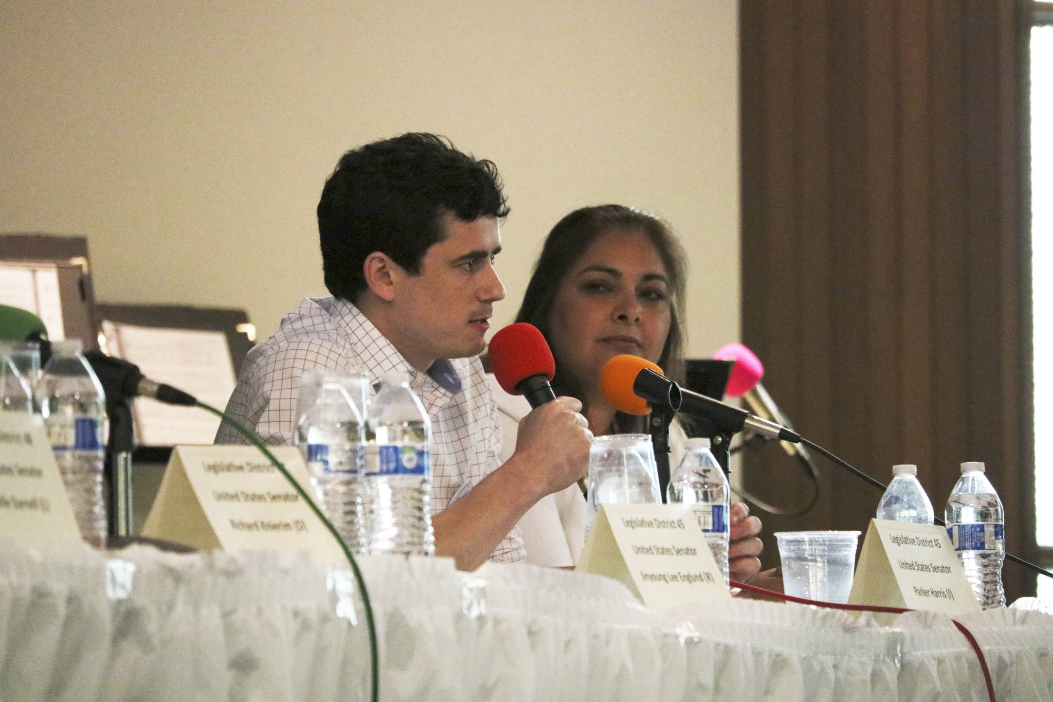 Parker Harris, left, and Manka Dhingra are running for the 45th District state Senate seat for this year’s November election. They participated in a candidate forum on July 11. Aaron Kunkler/Redmond Reporter