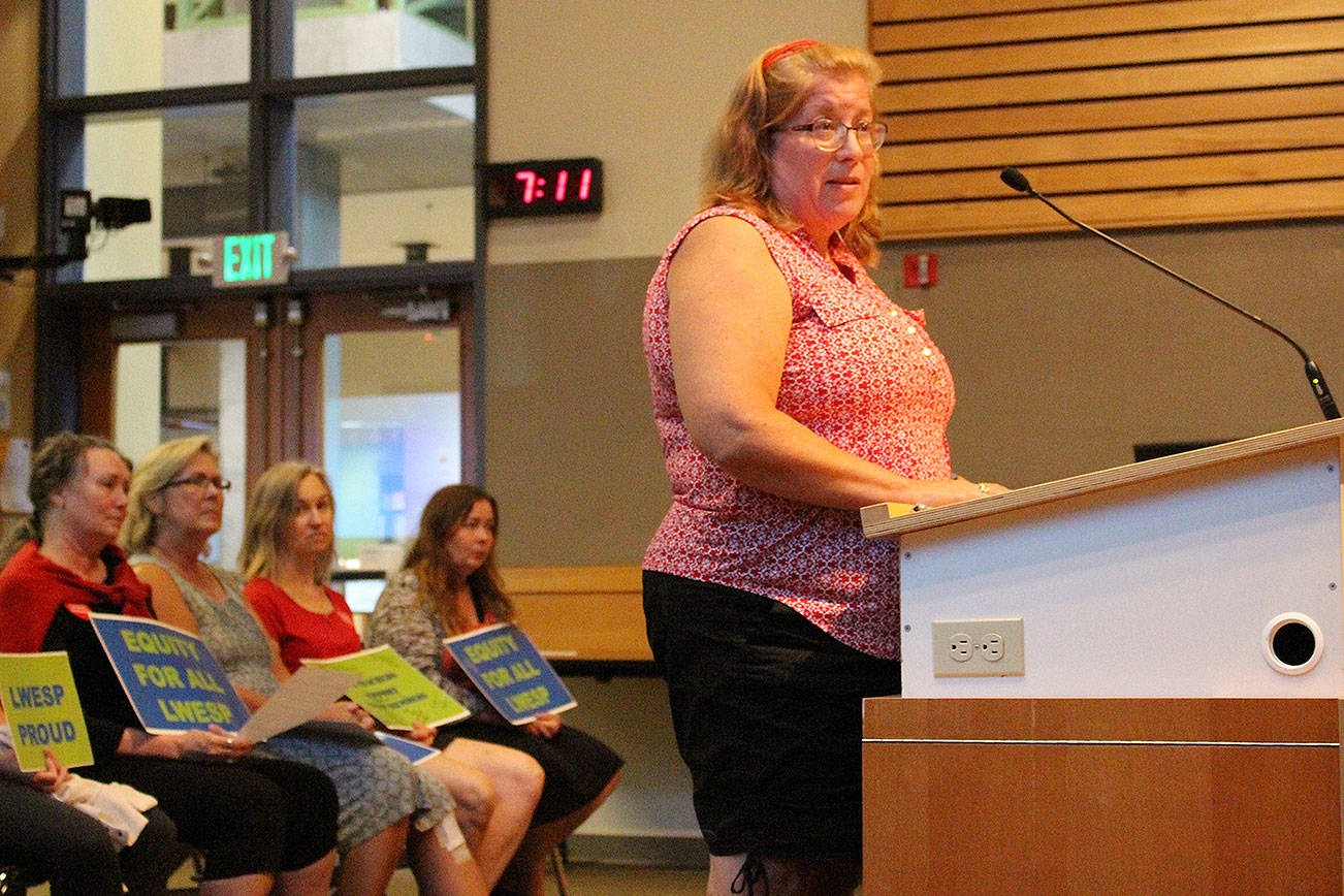 Madison Miller/staff photo                                Melody Kieffer, an office manager at Laura Ingalls Wilder Elementary School, addresses the school board on Aug. 12.