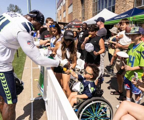 DK Metcalf shares a fist bump with a young fan. Photo provided by Maria Dorsten.